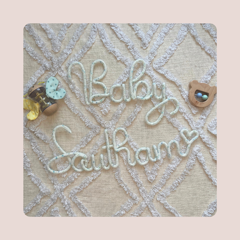 Baby name knitted milestone sign