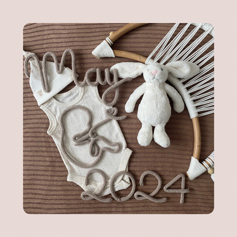 Knitted Baby with Month and Year Sign