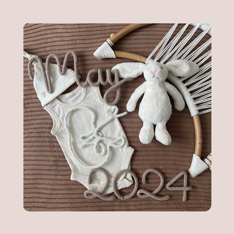 Knitted Baby with Month and Year Sign